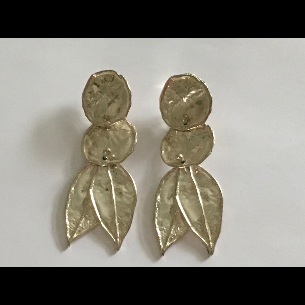 Sterling Silver circle and double leaf clip-on earrings. Featured in Vogue.